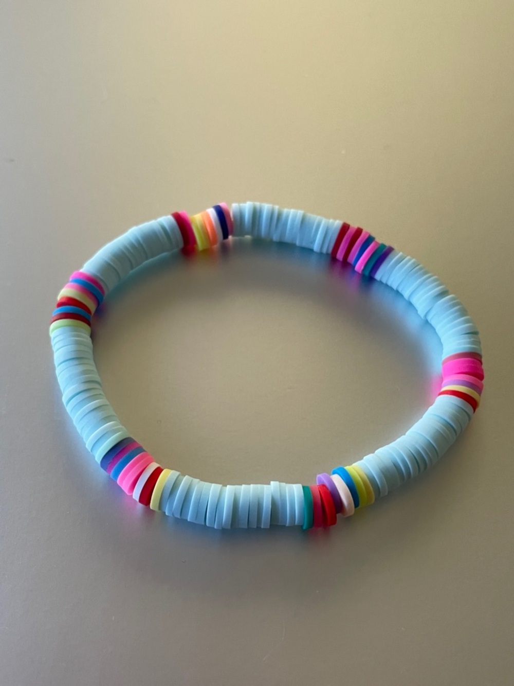 Stretch Bead Bracelet in Light Blue with Rainbow Accents